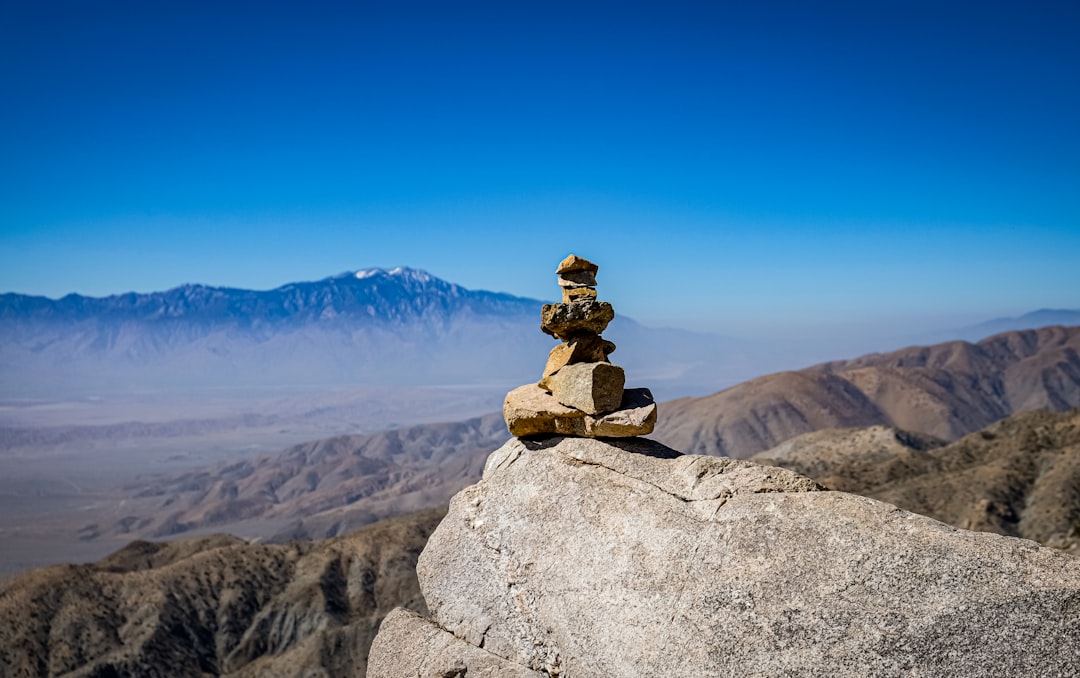 Person meditating peacefully in a serene setting
